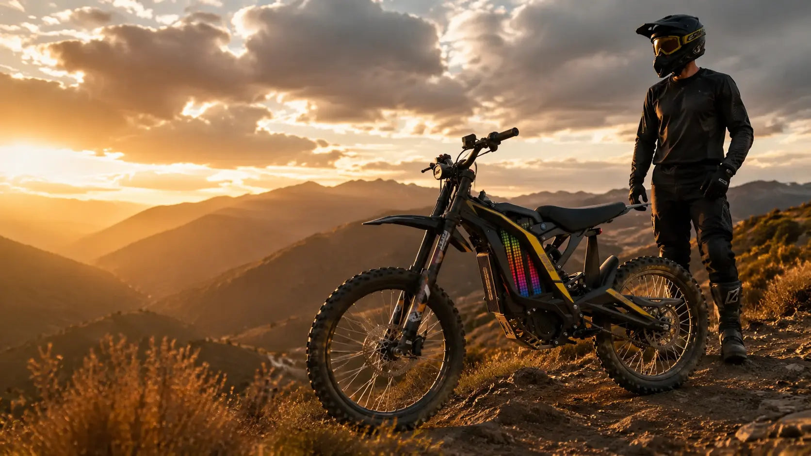 Sunset mountain scenery with rider beside electric dirt bike, illustration for electric dirt bike financing guide