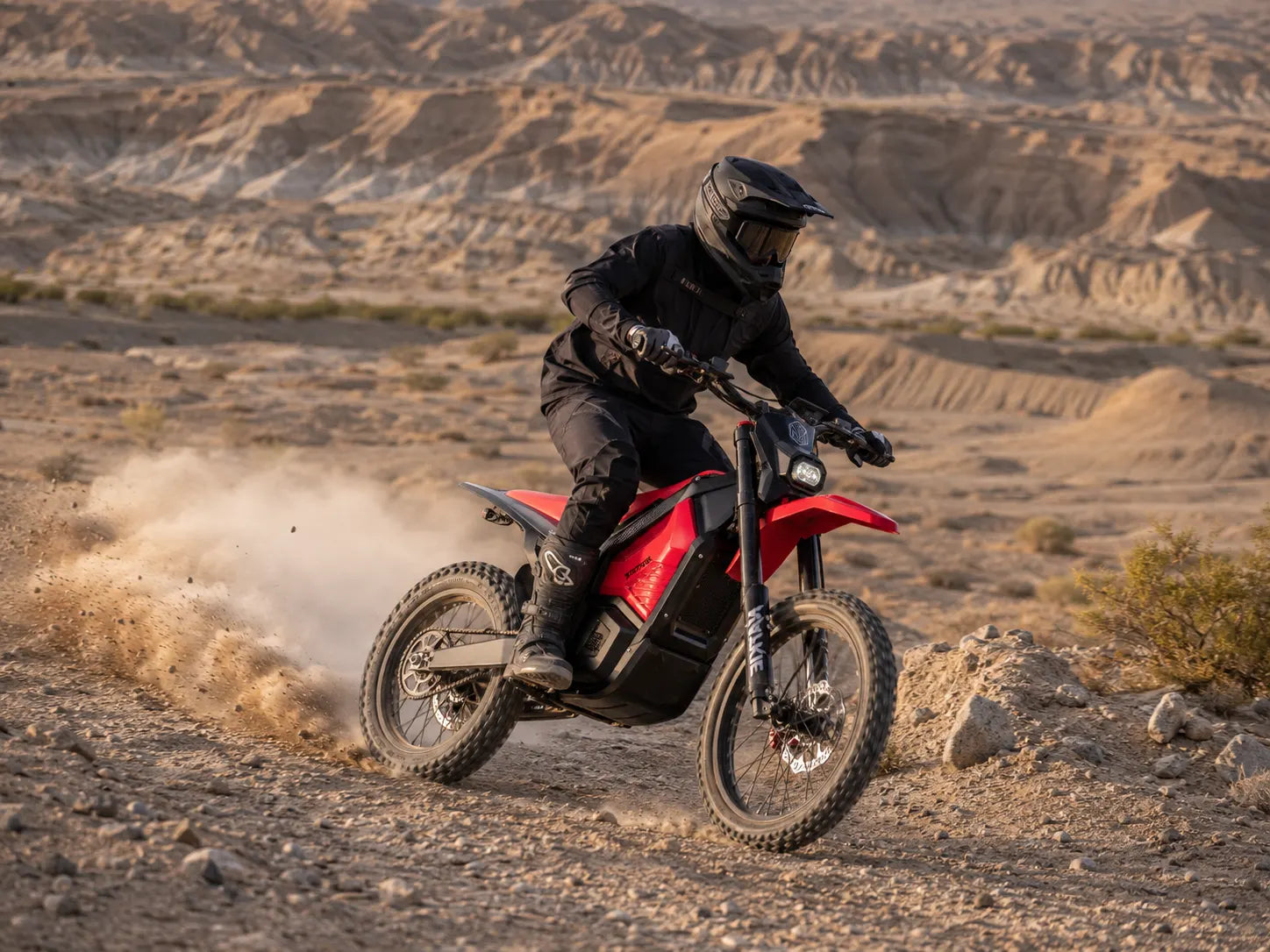 NATKIE electric dirt bike riding through desert terrain at Ocotillo Wells SVRA in California