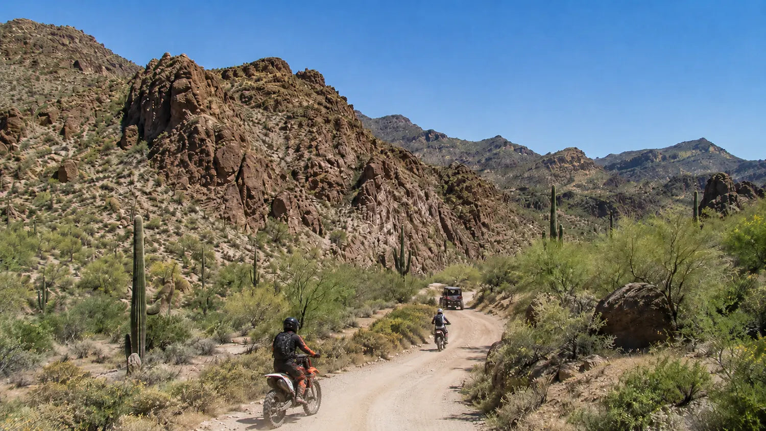 Electric dirt bike riding on Bulldog Canyon OHV trail in Arizona desert terrain