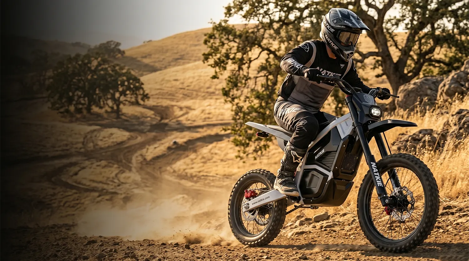 NATKIE electric dirt bike with rider on Northern California off-road terrain near Sacramento